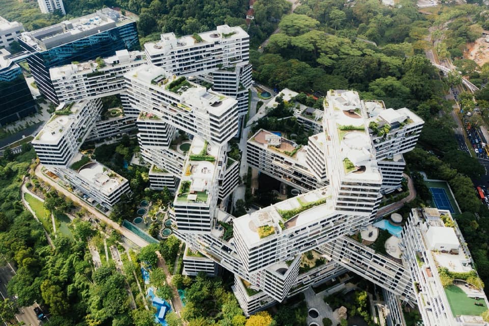 Aerial view of a large residential complex surrounded by trees