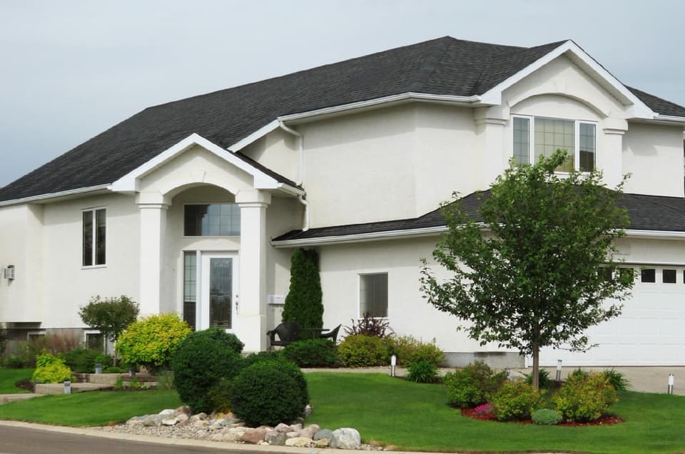 Suburban two-story house with a front lawn